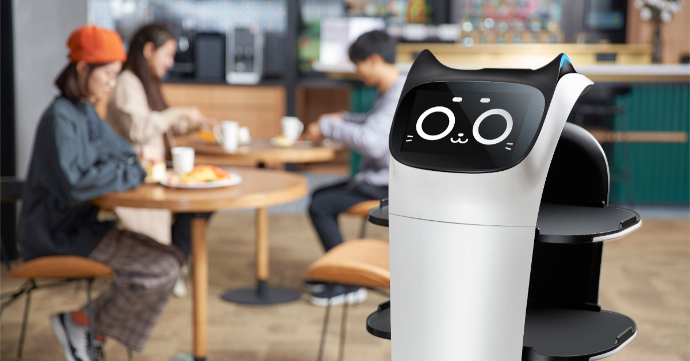 Pudu Robotics BellaBot serving in a restaurant.